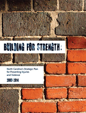 Image of the cover page of the North Carolina Strategic Plan for Preventing Injuries and Violence from 2009 - 2014, entitled "Building for Strength." The text on the cover page is in blue in white blocks, and in the background is a photo of a red and brown brick wall.